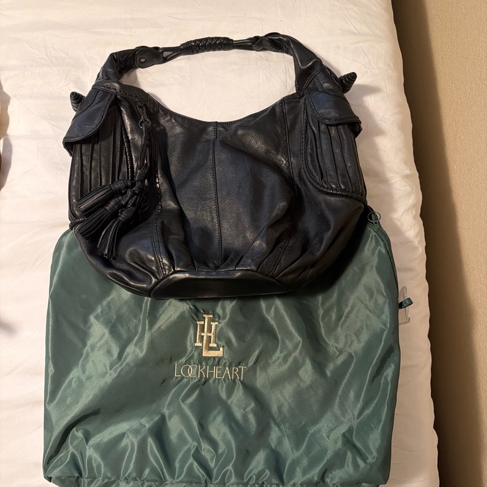 Black Leather Shoulder Hobo with Braided Handle and Tassel Accents